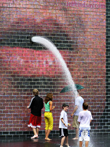People interacting with the amazing art at Chicago's Millennium Park, Aug. 11, 2005.