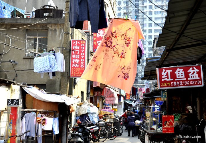A street scene in the alleys of old Shanghai near Laoximen and the South Bund Fabric Market, March 2012. Shanghai, 2012