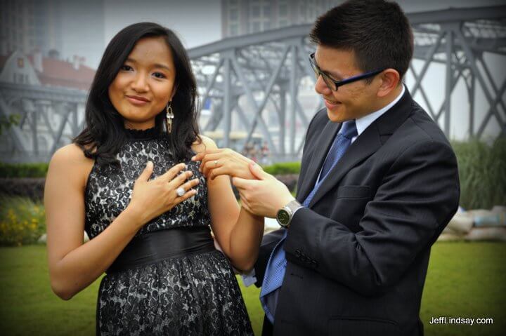 With Shanghai's famous first steel bridge n the background, James looks at the ring Joyce proudly wears.
