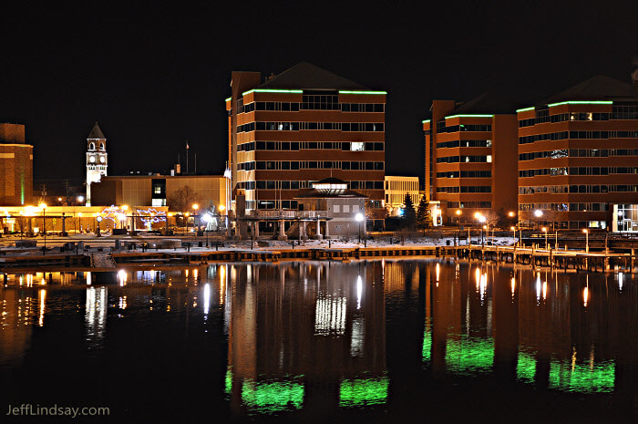 Downtown Neenah on a cold night, during the spring of 2010, as viewed from the lovely new bridge by Theda Clark hospital. The buildings with the green neon accents are the Bergstrom office buildings.