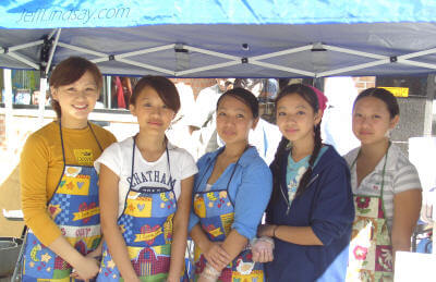 Five Hmong girls at Appleton's Octoberfest, Sept. 25, 2004, working to raise funds for a community group that helps needy families.