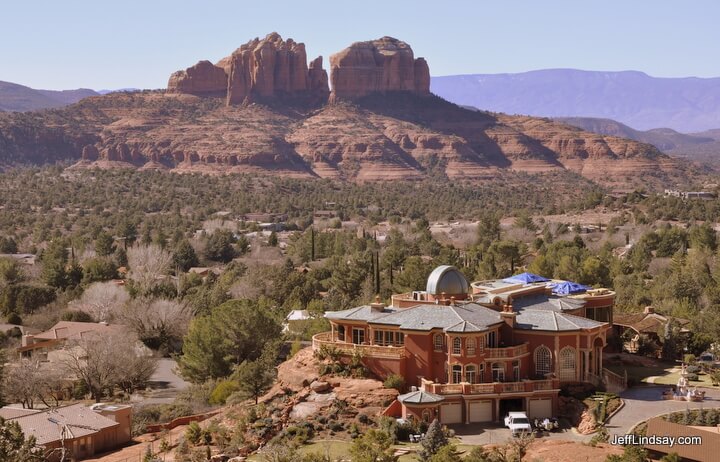 A controversial mansion in Sedona, Arizona showing the amazing scenery of its background..
