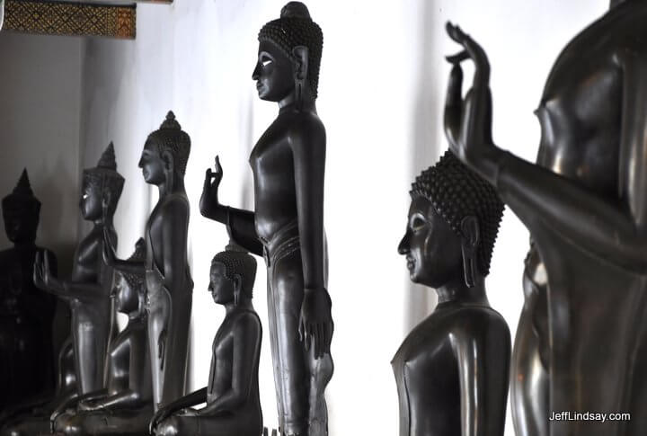 A row of Buddhist statues in a palace in Bangkok.