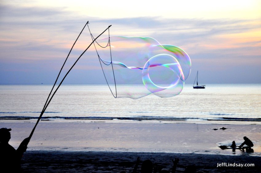 The bubbles from the bubble magician can form bizarre shapes and capture the light in musterious ways.