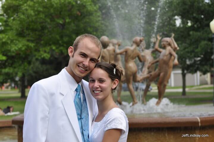 Daniel and Jenn in front of the famous Ring Dance sculpture at City Park in Appleton, Wisconsin, shortly after the wedding and just before their Appleton reception.