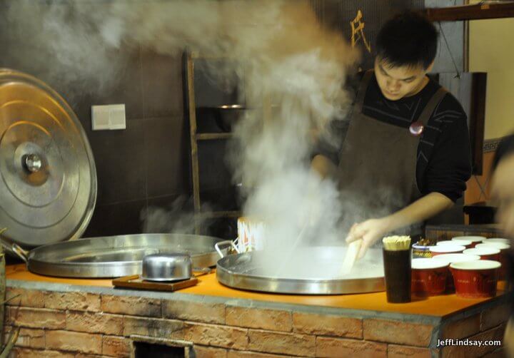 Xiamen, Fujian China, April 2013: steam from a noodle vat