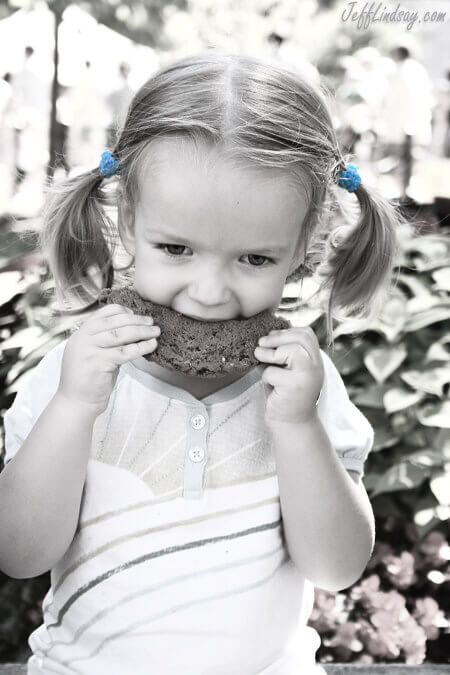 My granddaughter enjoying a cookie at a farmer's market in Wisconsin.
