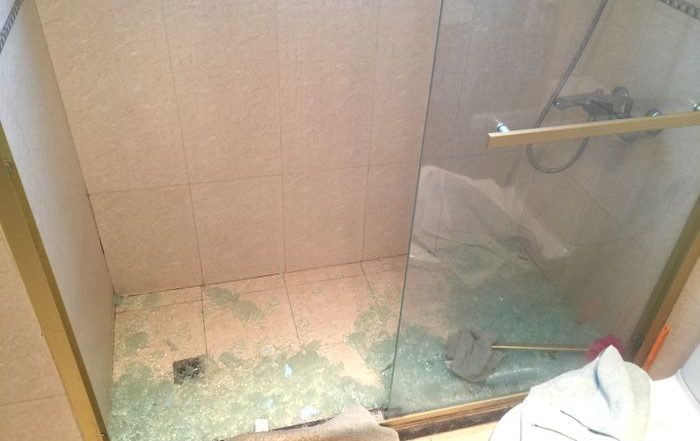 shattered glass from a shower door