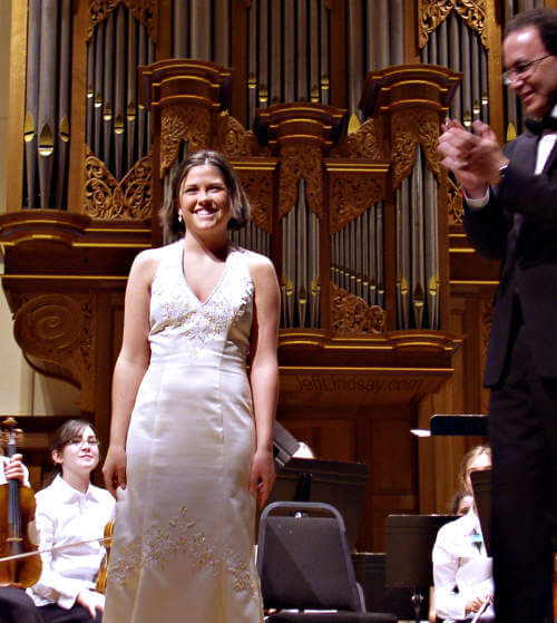Soprana Anna Koll, a senior at North High School, receives the applause of a delighted audience in Lawrence Chapel on May 22, 2005 for the 31st Annual Commencement Concert, presented by Appleton East, North, and High School Orchestras. Anna has just performed the Doll Song from Offenbach's Tales of Hoffman.