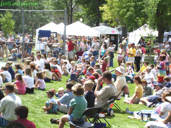 A crowd wathces a gymnastics exhibition.