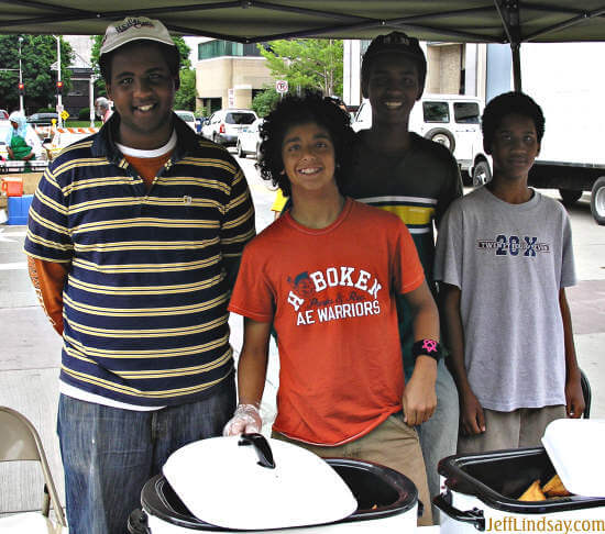 At the Appleton Farmers Market each Saturday morning, you can enjoy some of the best samosas I've ever tasted at this booth, run by a family who came to Appleton five years ago from Somalia. These polite and entertaining young men manage the booth, while mom in the background cooks the food. My son and I made a meal of these treats. Photo taken June 18, 2005.