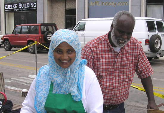 Here is Bashir and his lovely wife, Rahma, the parents of the boys shown above. Rahma is preparing the stuffing for their wonderful samosas at the Appleton Farmers Market on College Avenue, Saturday morning, June 18, 2005. Drop by before noon on Saturdays, just east of Houdini Plaza.