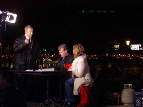 Mayor Timothy Hanna sits with local TV personalities after the parade to be interviewed.