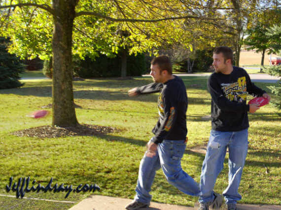 Cody, a disk golf enthusiast, demonstrates his technique at Plamann Park, October 10, 2004.