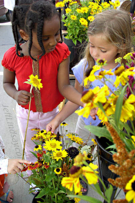 One of my favorite photos: two young ladies examine flowers at the Appleton farmers market, Sept. 11, 2004, on College Avenue.