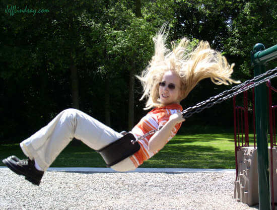 A relative of mine swinging at Peabody Park in Appleton, July 2004.