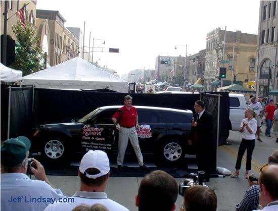 Mayor Timothy Hannah and an automobile suddenly appear out of nowhere (?) in an illusion performed by the two organizers of Houdini Days, Chris Cochrane and Mike Schroeder of the Comedy Magic of Chris and Mike.