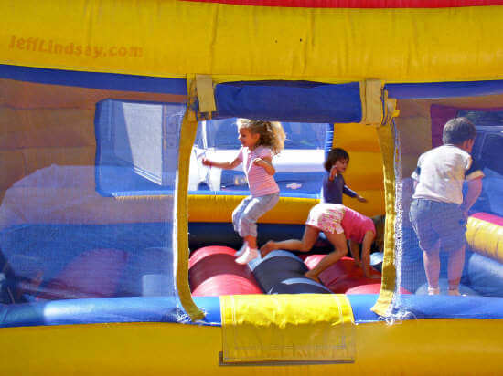 Children have fun jumping in an inflated environment.