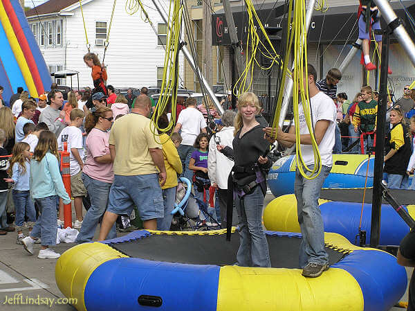 A girl prepares for a bungee activity.