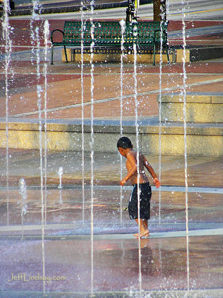 A boy playing in the water fountains in Atlanta's Centennial Olympic Park, Sept. 13, 2005.