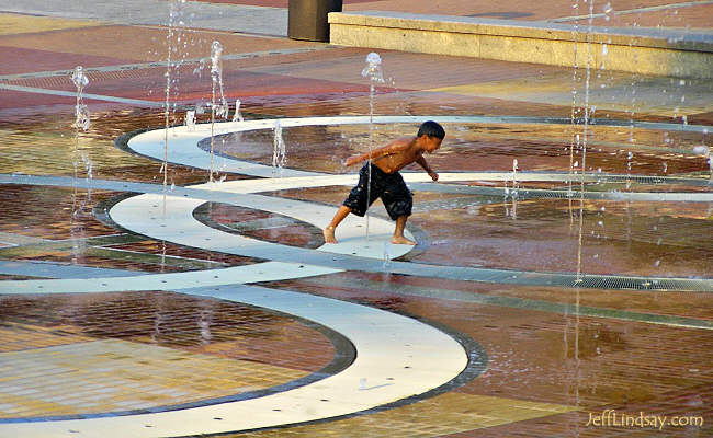 A boy running through the fountain at Atlanta's Centennial Olympic Park, Sept. 2005.