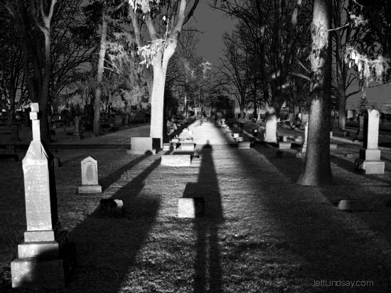 Self-portrait: my shadow near sunset in a Neenah graveyard, March 2004.