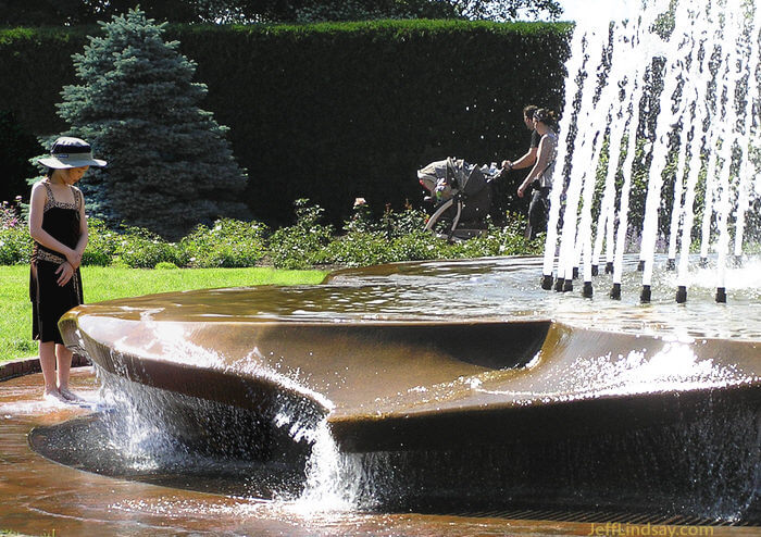 Girl viewing a water fountain in the Rose Garden at the Chicago Botanic Garden, June 2008..