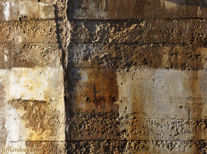 Abstract of a cement wall supporting a railroad bridge near Pierce Park in Appleton, Wisconsin.
