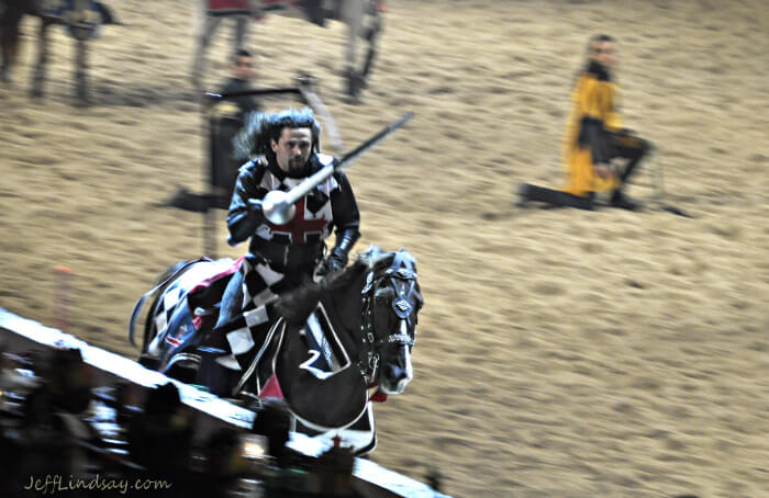 Action shot of a knight riding at high speed on a horse in a competition between knights at Medieval Times, Chicago (Schaumburg), March 2010.
