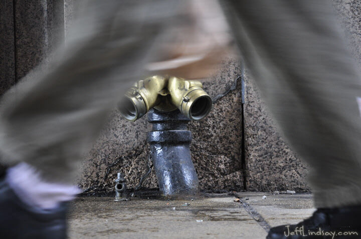 Standpipe for a firehose on a sidewalk in downtown Chicago.