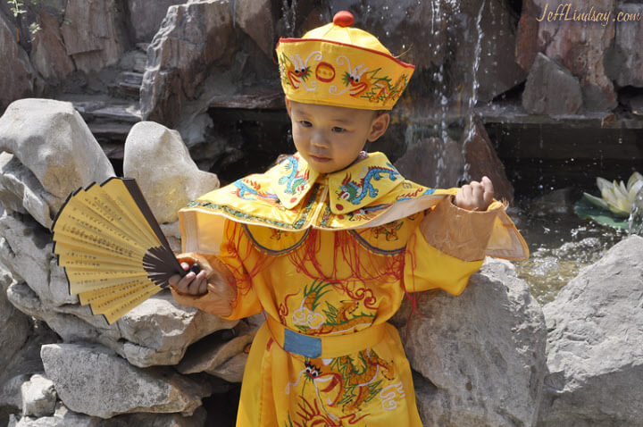 A little emperor poses at a court in the Cheng Huang Temple.