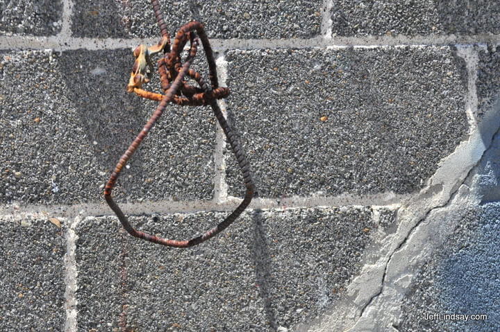 Iron rebar and cinder block in a back alley in downtown Appleton, Wisconsin.