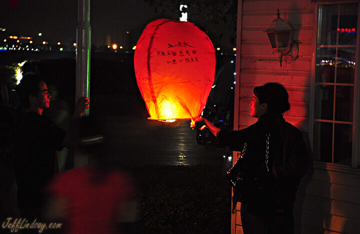 Fire lantern being lit (illegally) near a lake in Suzhou, China.