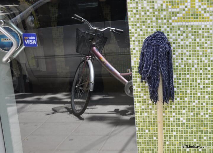 Mop, door, and bike. Exploring the intersections of mobility, transformation, and mopping. 