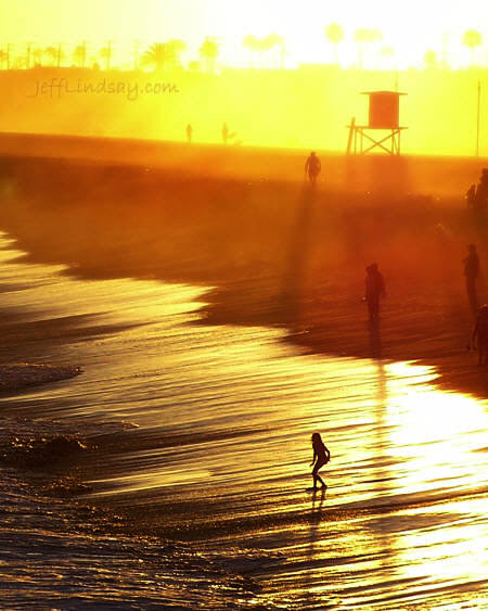 A girl prepares for incoming waves at Newport Beach, California, June 2005. I took this photo from a pier using an Olympus C-725 Ultrazoom camera. It's one of my favorites.