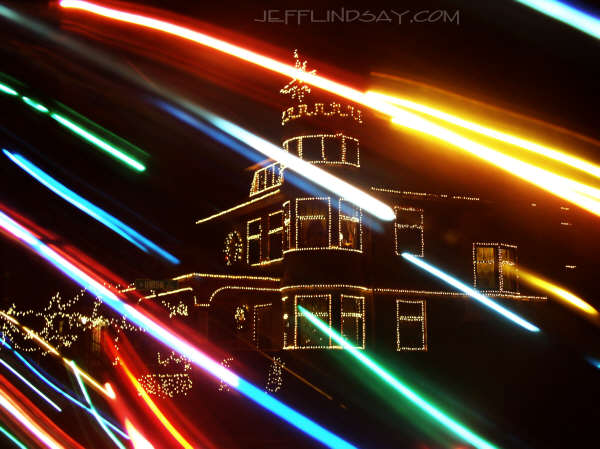 Photograph of a lovely home in Appleton with Christmas lights - superimposed with the image of some blurred  lights from a Christmas tree.