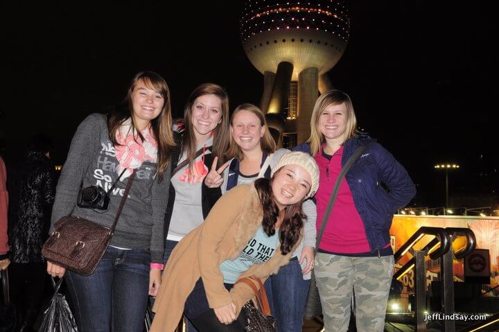 Local Chinese girl asked to join in the photo with these Americans.