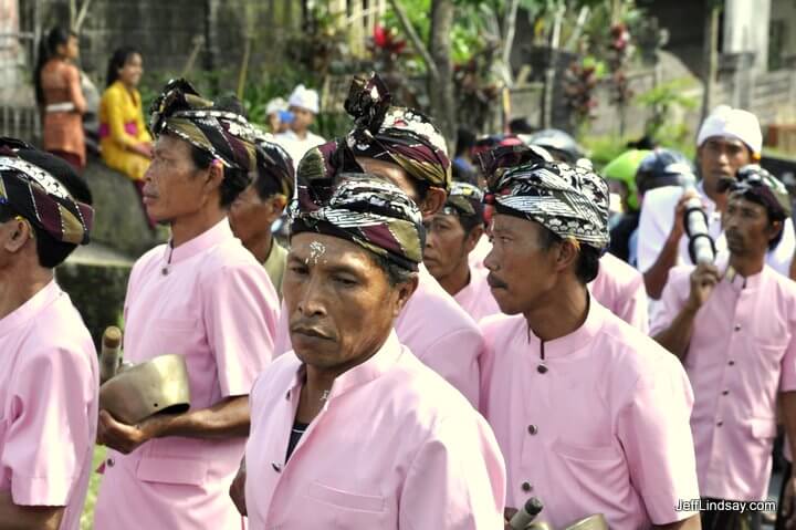 Men in pink: A procession at a Hindu Temple in a Bali, near Besakih.