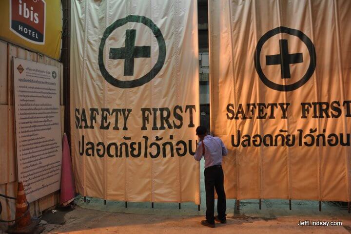 Safety First: a policeman looks past the Safety First barriers to a construction site at a hotel--just moments after I saw a young child walk into the area.