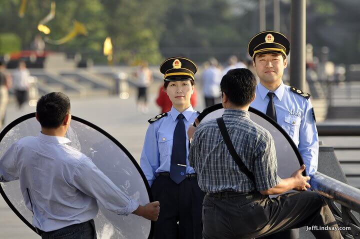 Two of China's finest pose for some camera work on the Bund, early morning, May 2011.