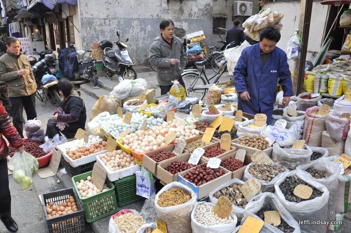 Eggs, dates, seeds, and other dry goods being sold in the old city of Shanghai near the Xiaonanmen. Shanghai, 2012