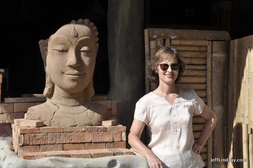 My wife near a Buddhist statue on Lanta Island.