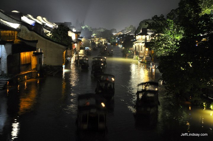 Boats at night on the main canal in Wuzhen.