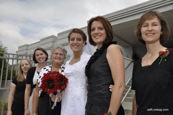 Women from both families show their support for the newlywed couple.
