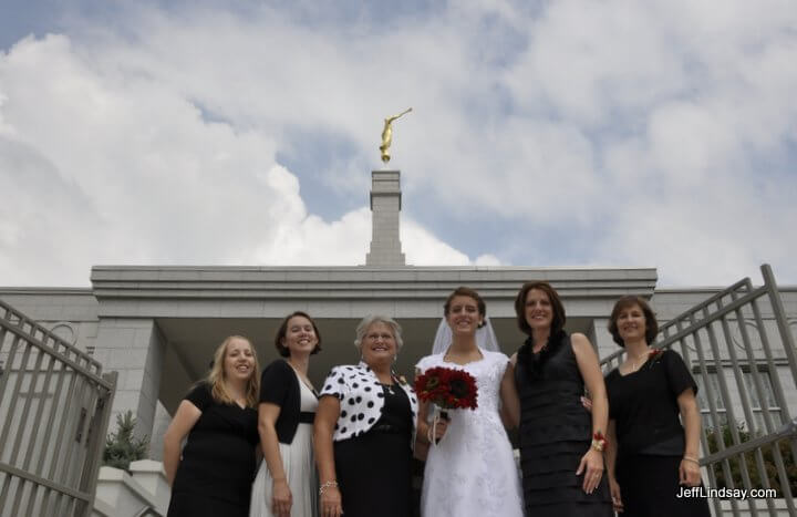 Women from both families show their support for the newlywed couple.