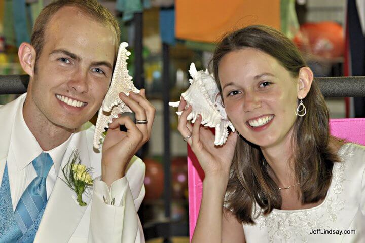 The young couple communicates with their new high-tech shell phones.