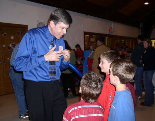 Jeff doing magic tricks for some kids at the Classical School in Appleton.