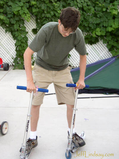 Benjamin on two scooters at his grandparents' home in Sandy, Utah.