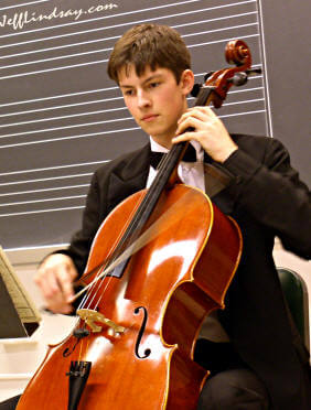 Benjamin Lindsay playing the cello.