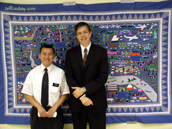 Jeff and Elder Vue, a Hmong missionary for the Church of Jesus Christ of Latter-day Saints, in front of a Hmong tapestry shortly before Jeff spoke as a guest speaker at the National Lao-Hmong Recognition Day, July 23, 2005, in Oshkosh.